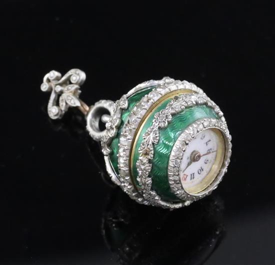 An early 20th century continental silver gilt, green enamel and diamond set ball timepiece pendant,